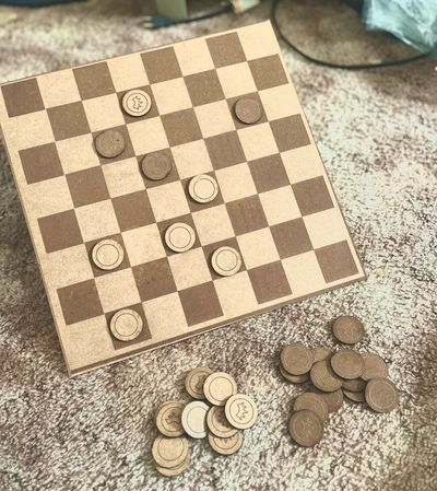 A checkers board made of masonite